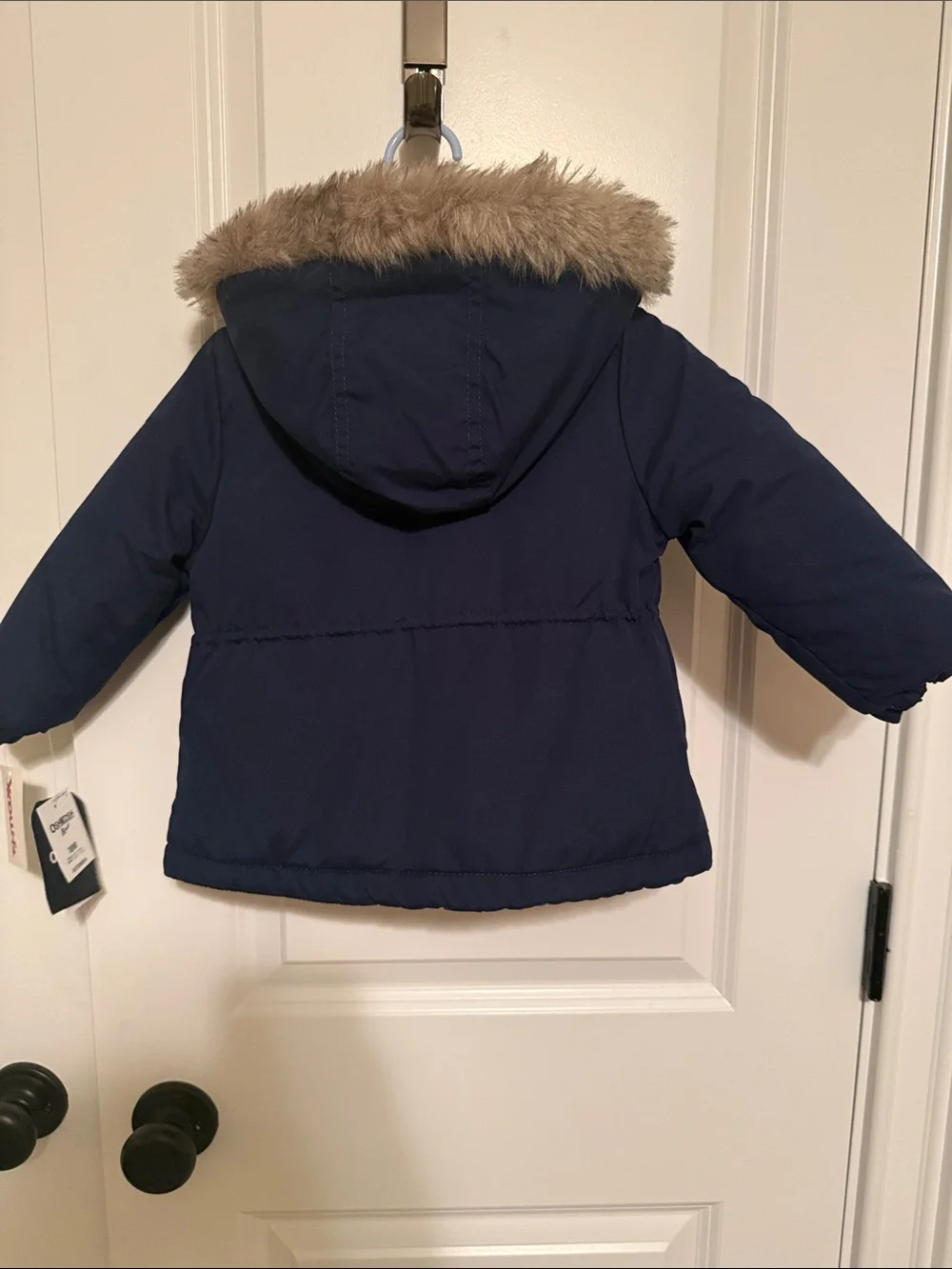 Girls winter coat with hood. Navy blue outside with pink fleece inside